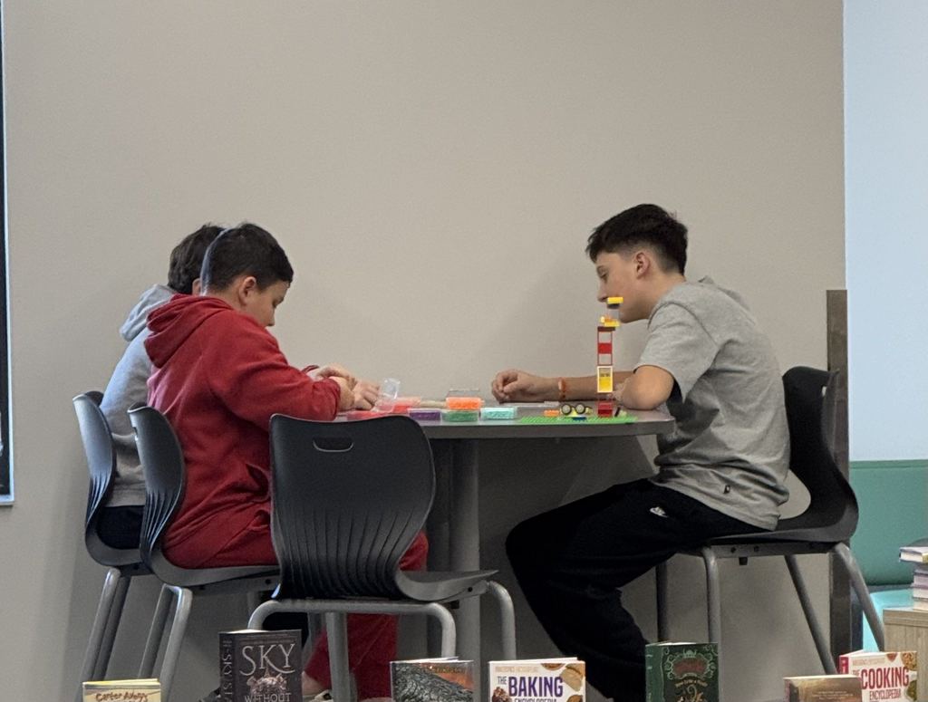 Students are building Legos. 