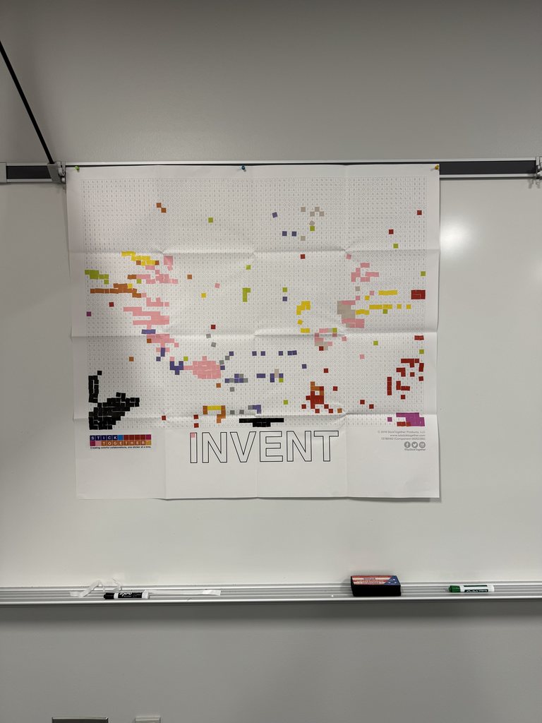 A picture of a poster that is being filled in by small square stickers. 