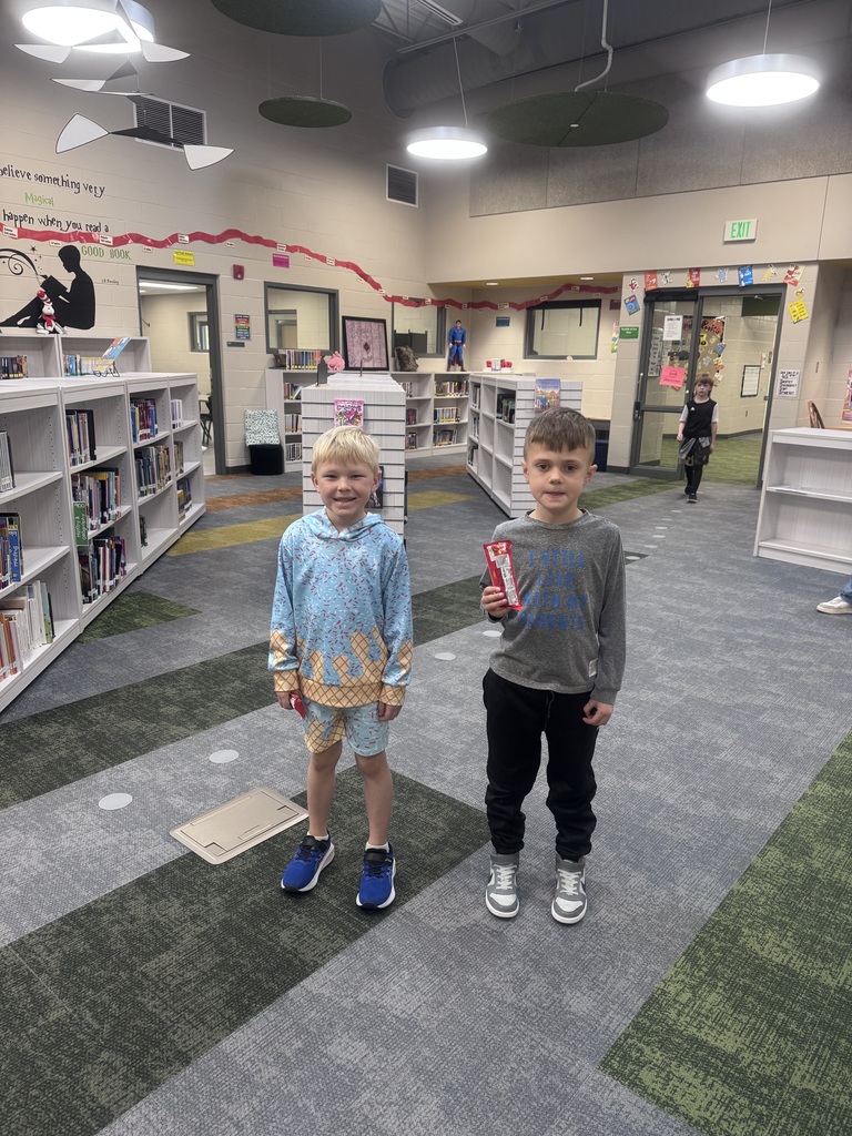 students posing in the library