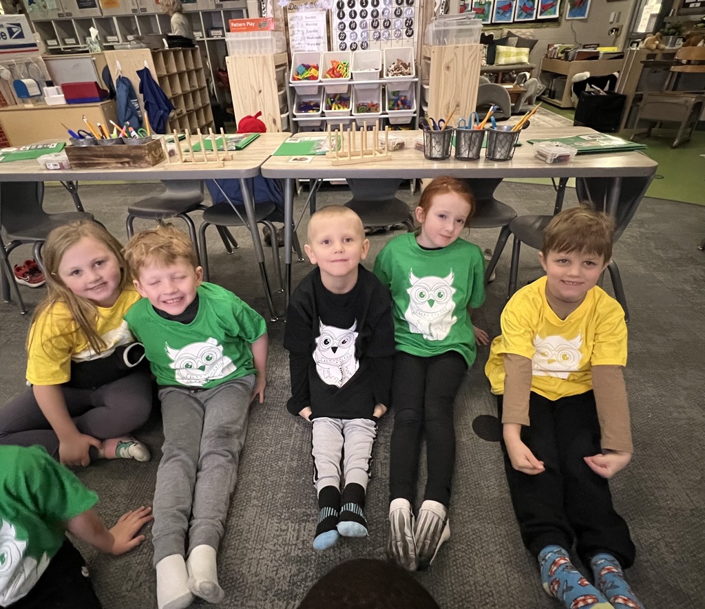 students posing with their socks for read across america week