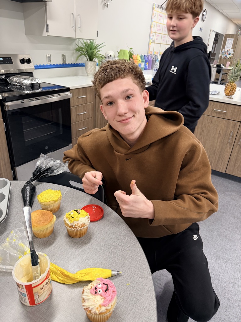 A student is decorating cupcakes.