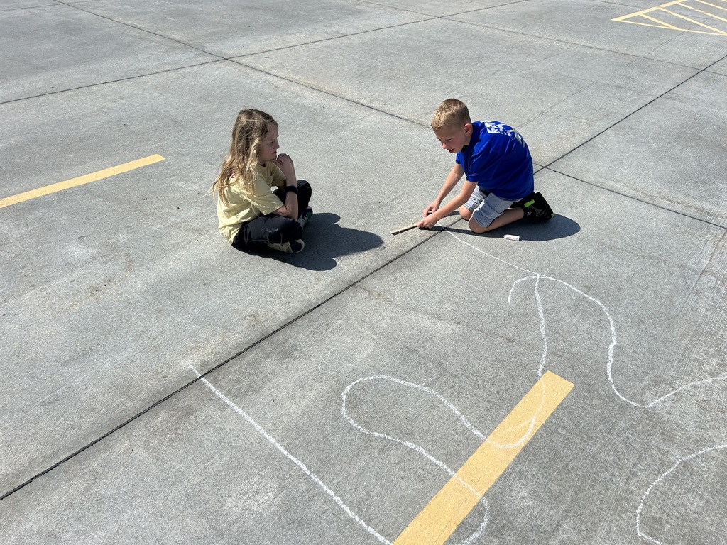students measuring with chalk