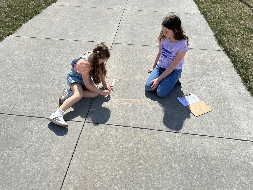 students coloring with chalk