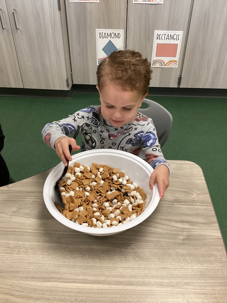 student mixing trail mix