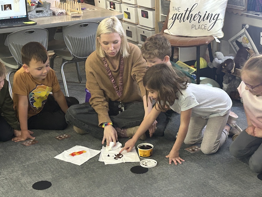 students in a circle learning about worms
