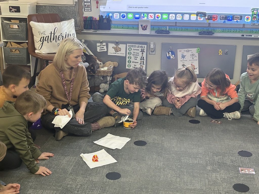 students in a circle learning about worms