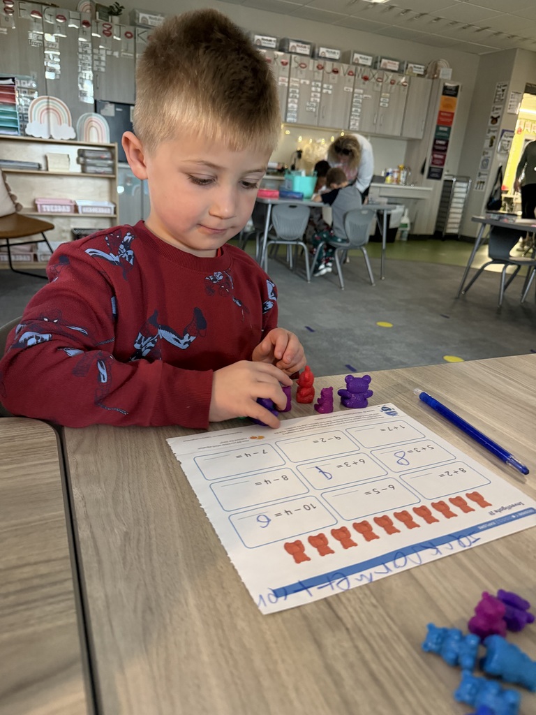 student working on math using counters