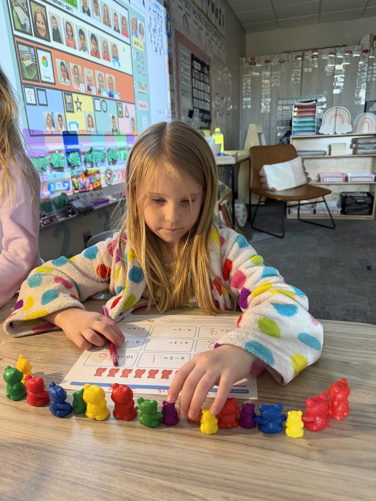 student working on math using counters