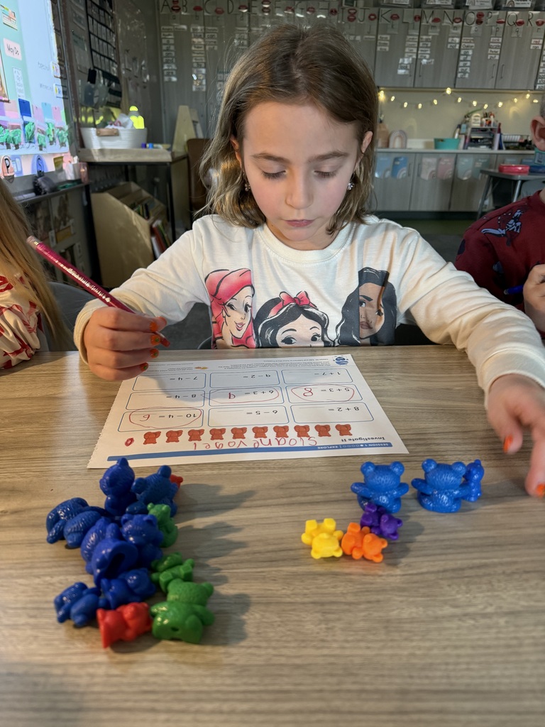 student working on math using counters