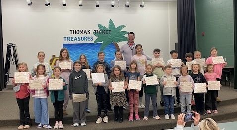 The Champions of Cooperation and Mr. Basye pose for a picture.