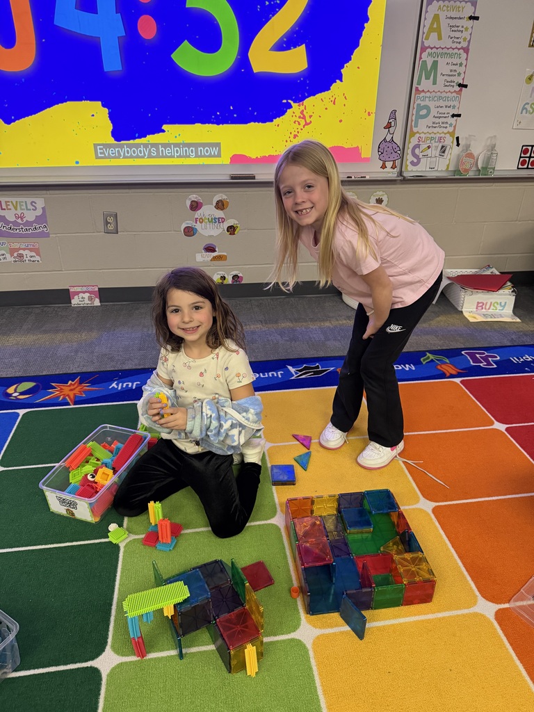 students building with magnatiles