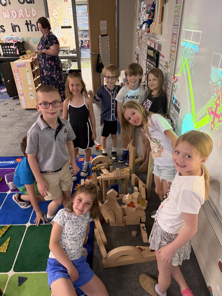students building with wooden blocks