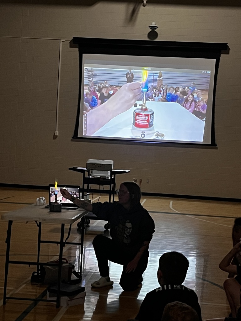 students watch the video of a flame lab
