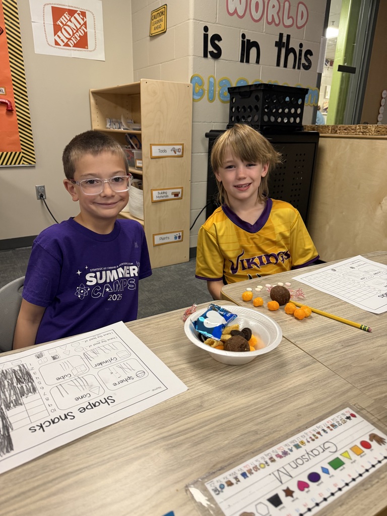 first graders using snacks to make shapes, graph, and collect data.