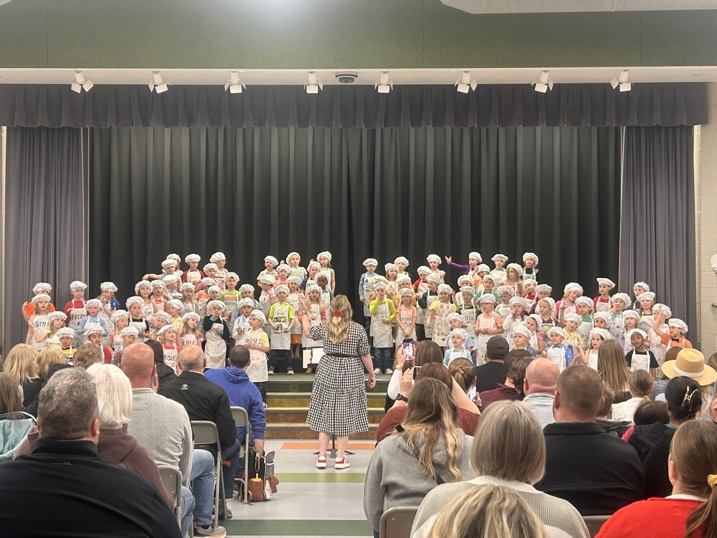 musical concert with students in chefs attire