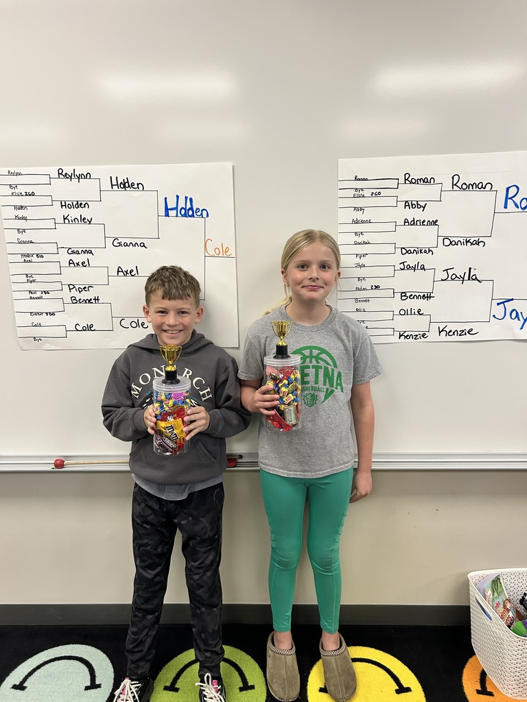 students holding up prizes for winning the multiplication final four