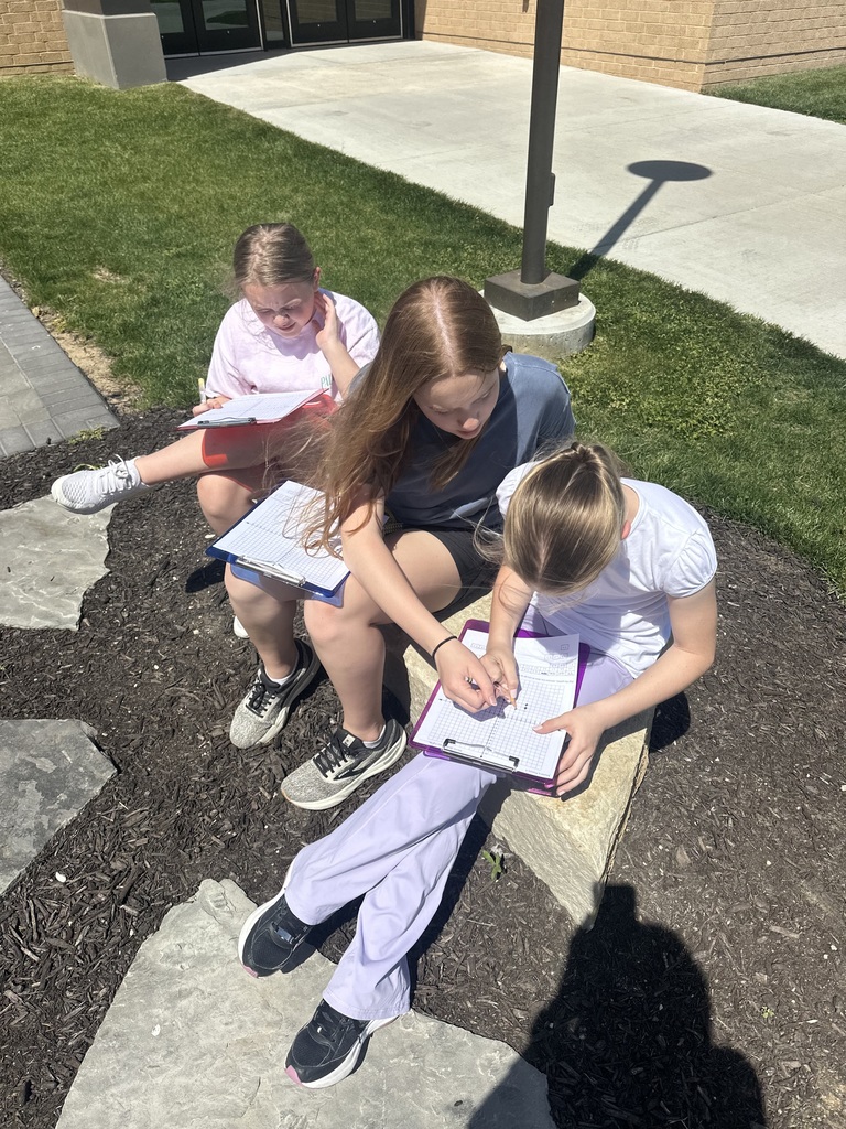 students working on an outdoor classroom