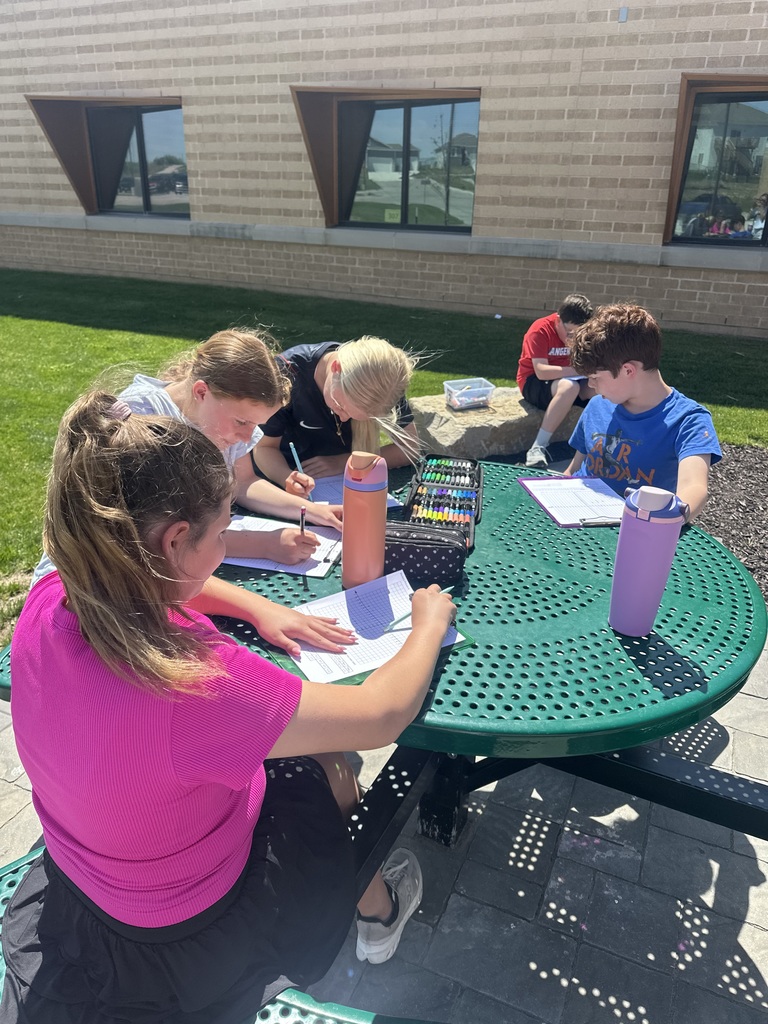students working on an outdoor classroom