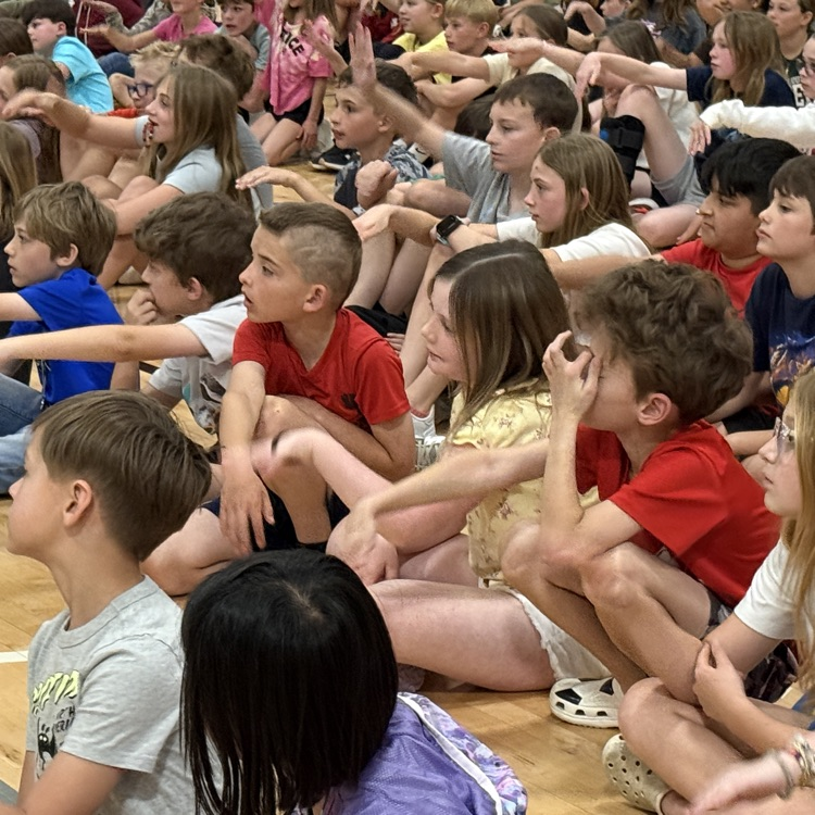 students move their hands like a whale tail