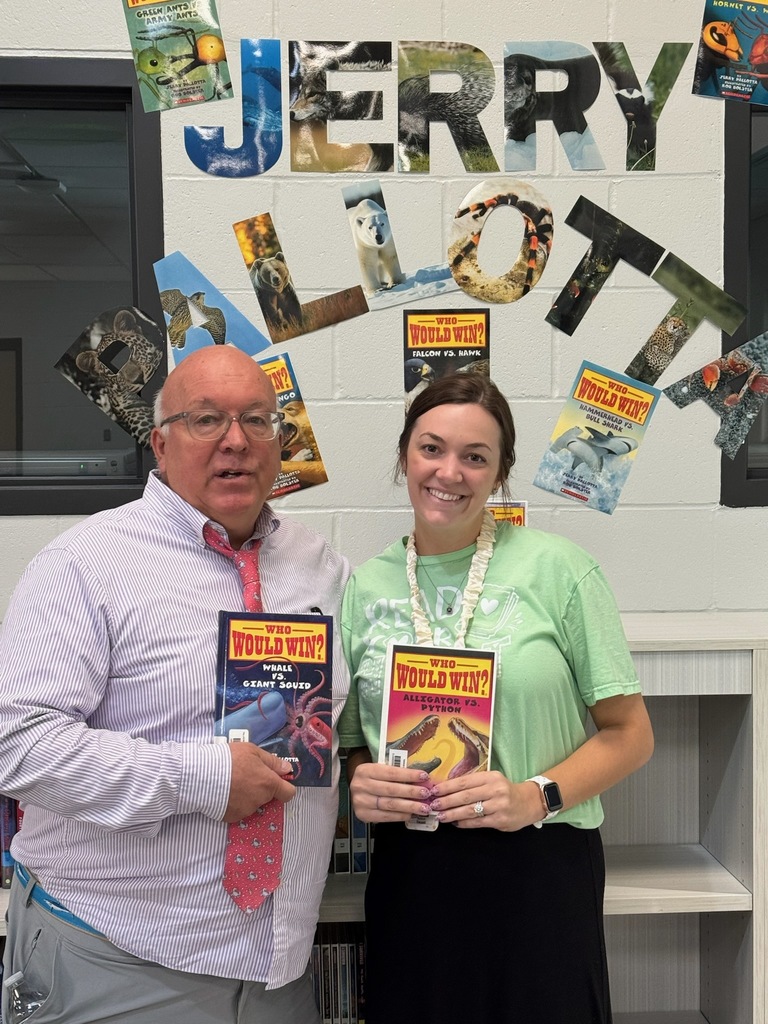 Mrs. Vacanti with Jerry Pallotta posing with a few of his Who Would Win books! 