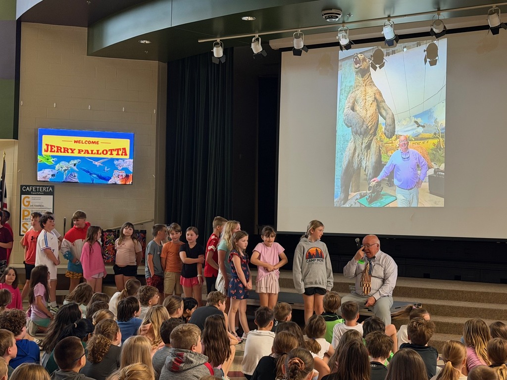 A photo of students in line to ask Jerry Pallotta a question.