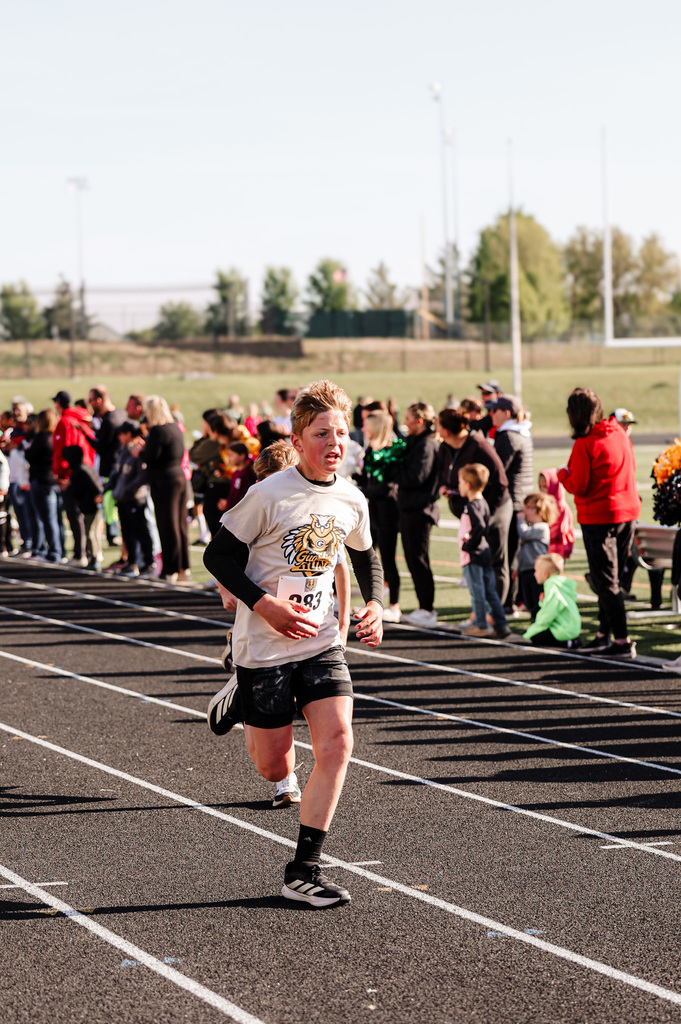 boy running on a track