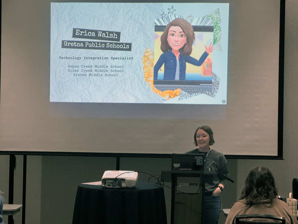 speaker standing behind podium with presentation screen behind them saying "Erica Walsh Gretna Public Schools Technology Integration Specialist"
