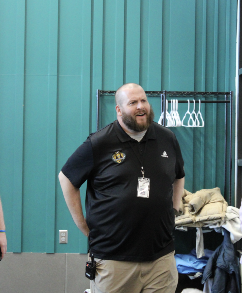 Mr. Runyon looks confused as he enters the surprise assembly. 
