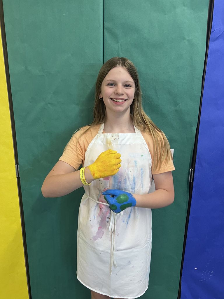 A girl smiling at the camera. 