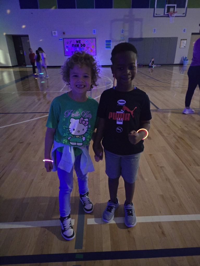 Two first grade students smile for a picture! 