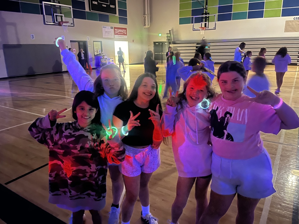 4th grade girls pose for a photo during the party. 