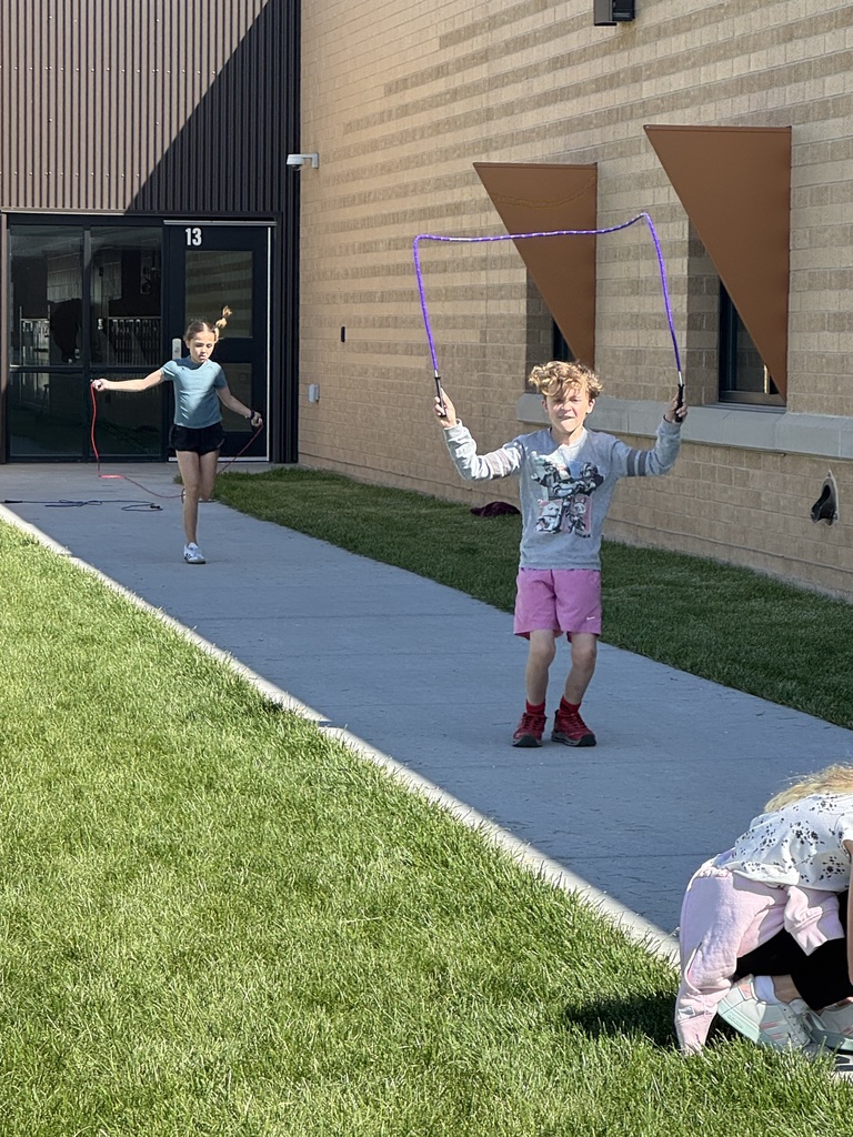 students jump roping outside
