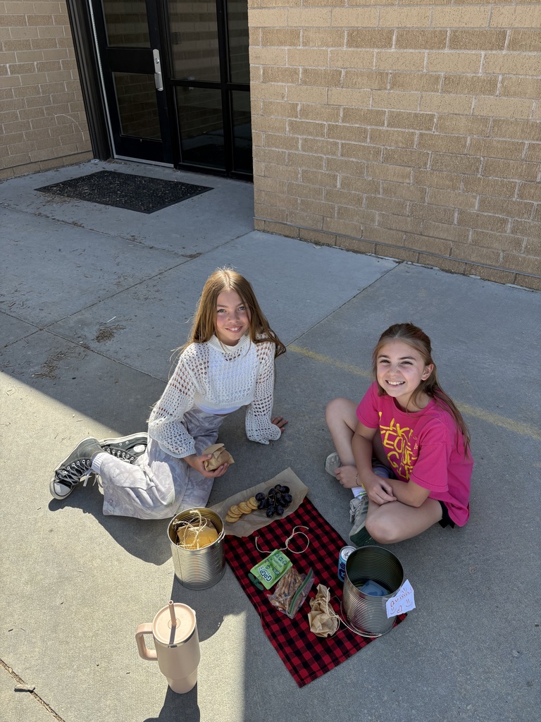students eating from the tin cans