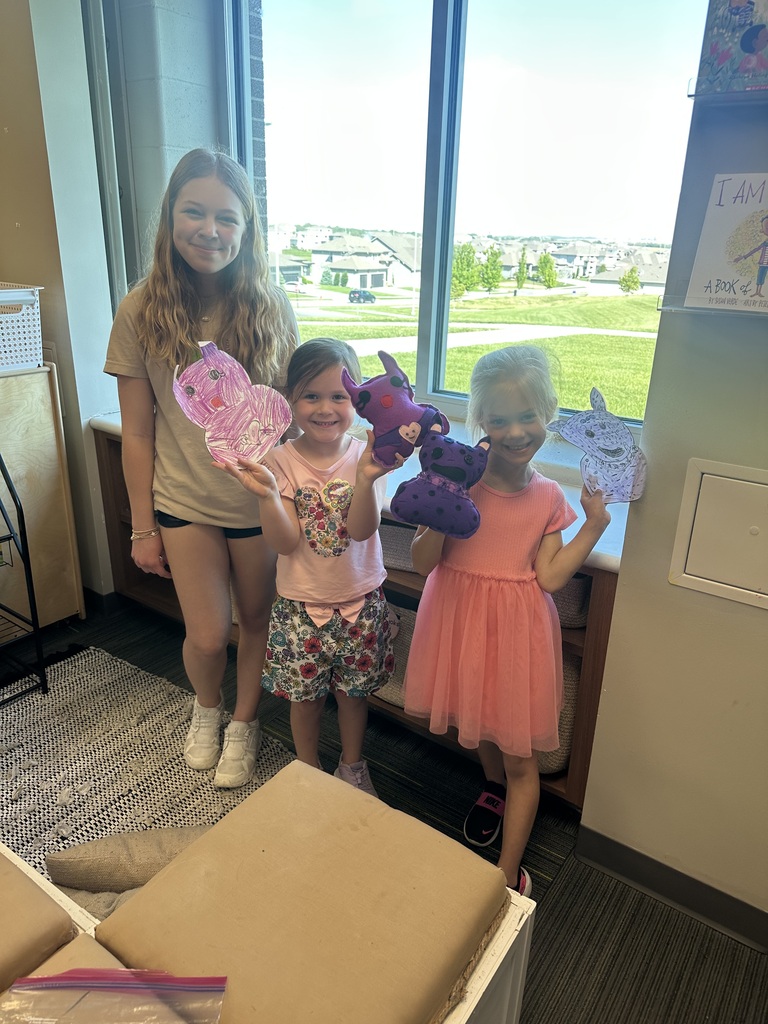 Photo of one 8th grader and two kindergarteners.