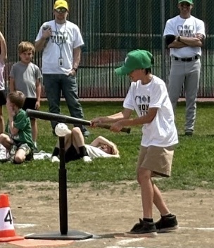 A Guardian athlete hitting the baseball