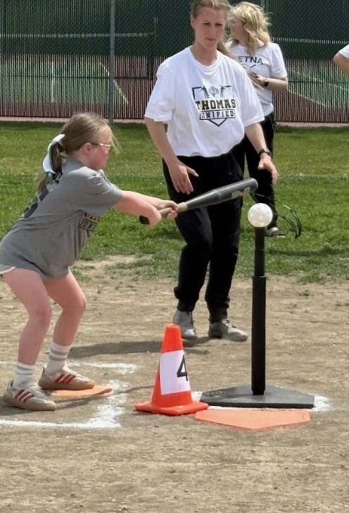 A Guardian athlete hitting the baseball