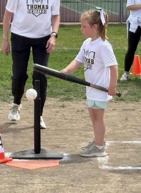 A Guardian athlete hitting the baseball
