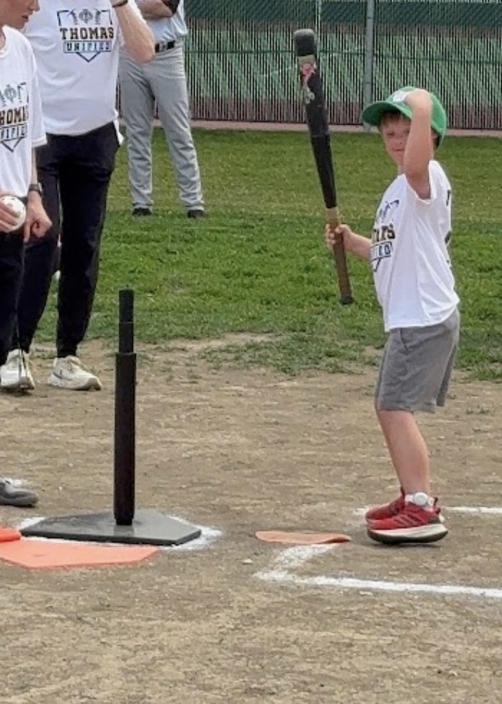 A Guardian athlete hitting the baseball