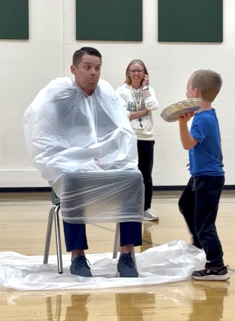 Mr.  Basye getting pied in the face