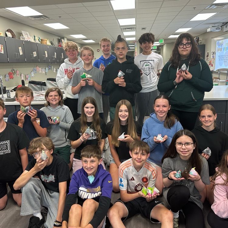 photo of students lined up holding their bean bag chickens.
