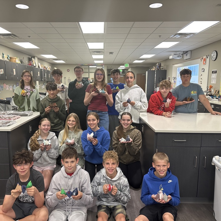 photo of students lined up holding their bean bag chickens