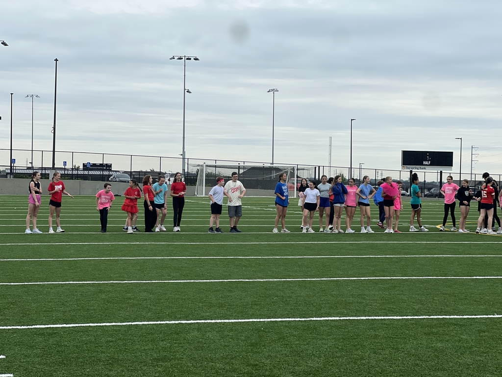 Photo of students lined up on the kickball field.