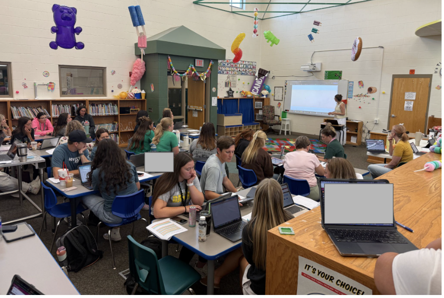 5th grade teachers from across the GPS district are seated in the library and learning about a new assessment.