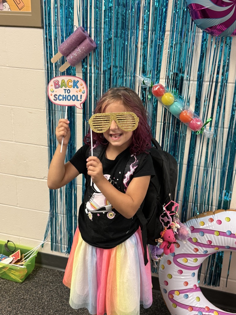 A student poses at the picture booth at open house on Monday, Aug. 10th.