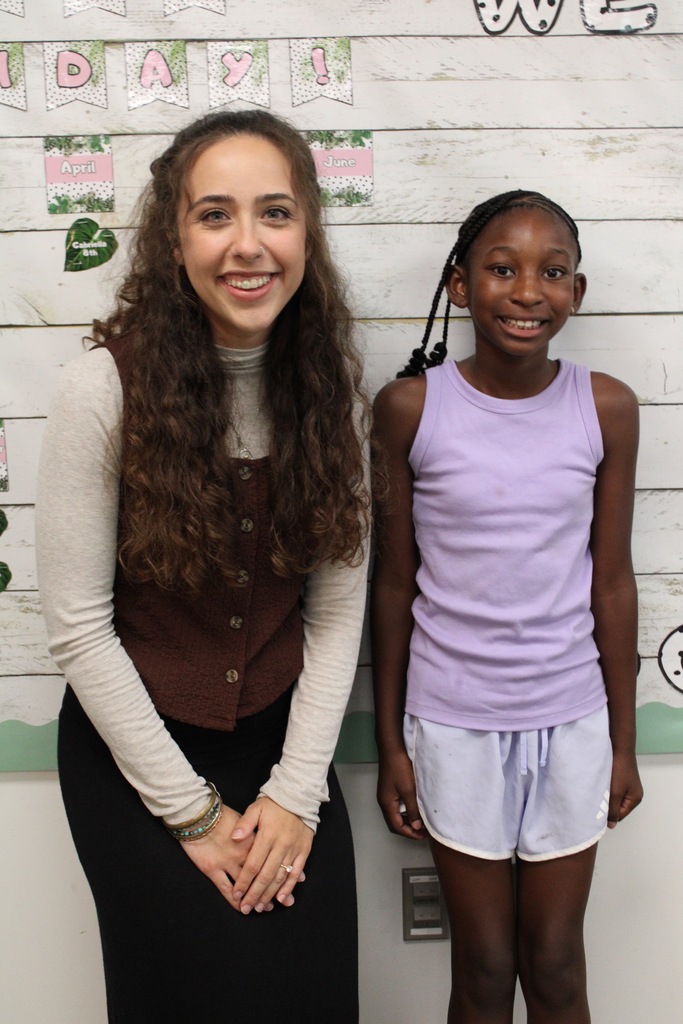 Miss Krula poses for a picture with one of her fourth grade students.