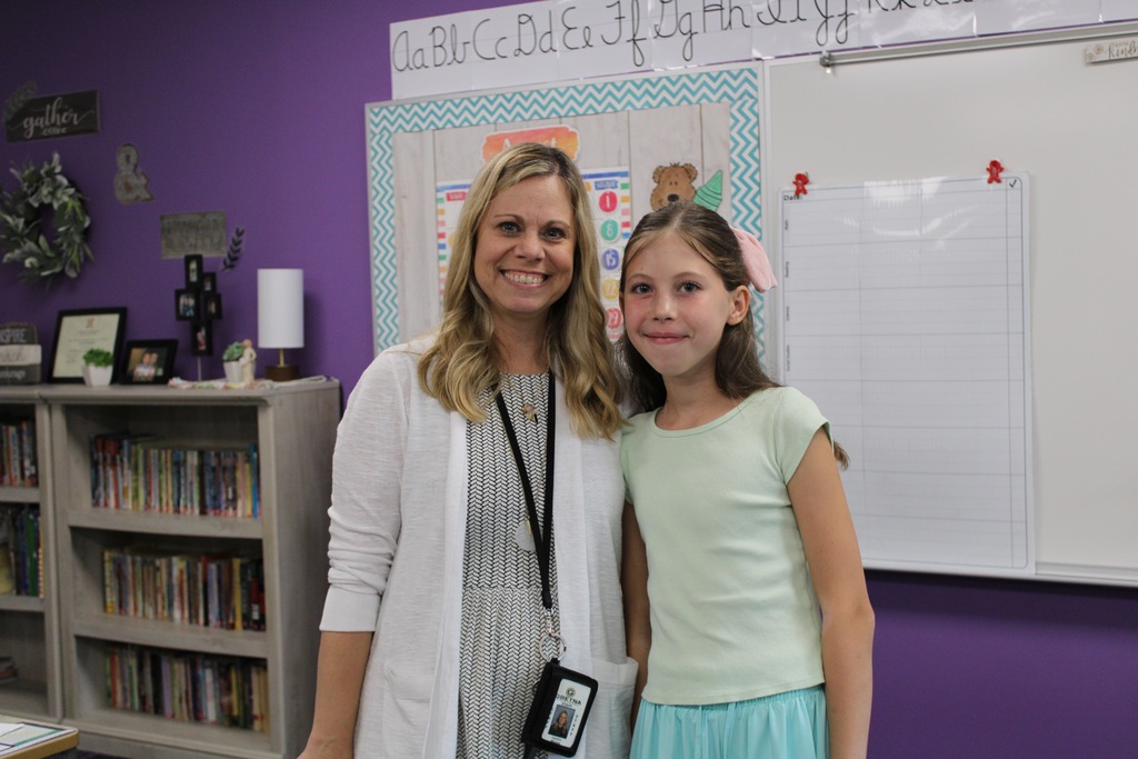 Mrs. Nixon smiles with one of her new fourth graders.
