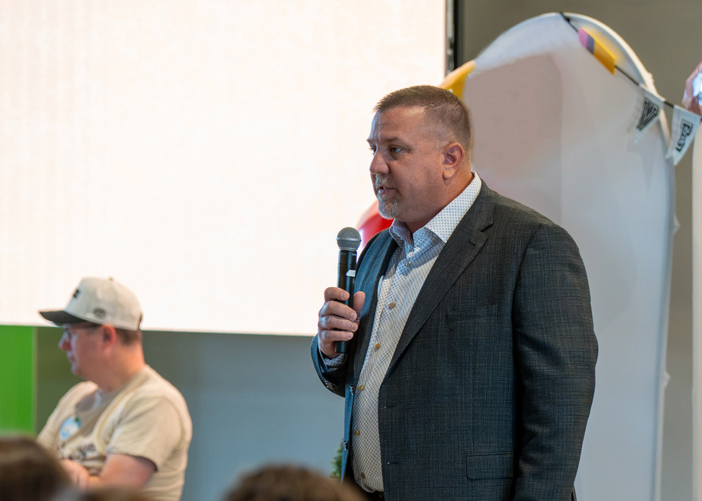 Gretna Public schools Superintendent Travis Lightle speaking to the new teachers at Journey Church breakfast