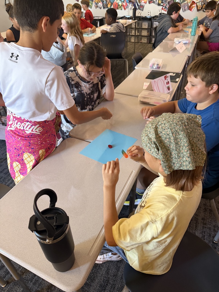 A group of student working at tables. 