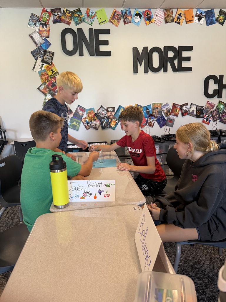 A group of student working at tables. 