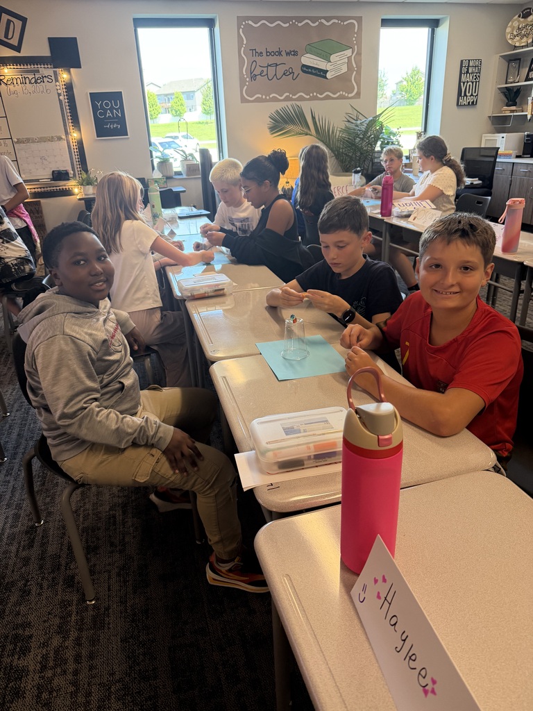 A group of student working at tables. 
